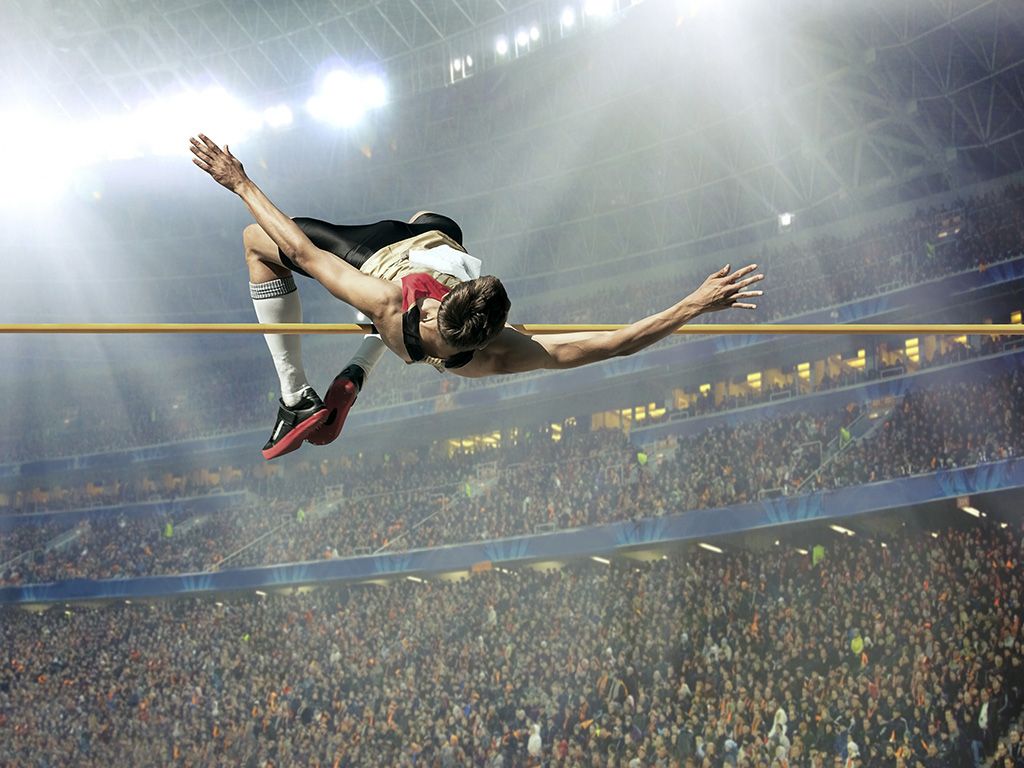 Op 13 maart 2023 overleed een pionier uit het hoogspringen op zijn 76e. De Amerikaan introduceerde een revolutionaire techniek om richting de mat en de lat te lopen en te springen. Graag de naam van het type sprong dat je op de foto ziet.